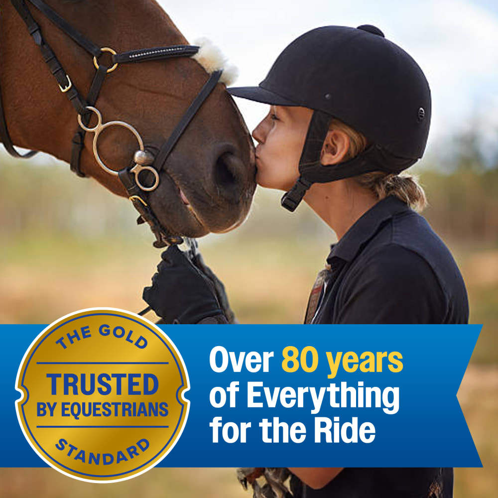 Young equestrian kissing a horse with Farnam's 80-year trust badge